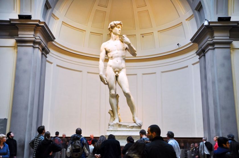 Tourists look at David by Michelangelo on November 10,2010 in Galleria dell'Accademia in Florence. Italy.